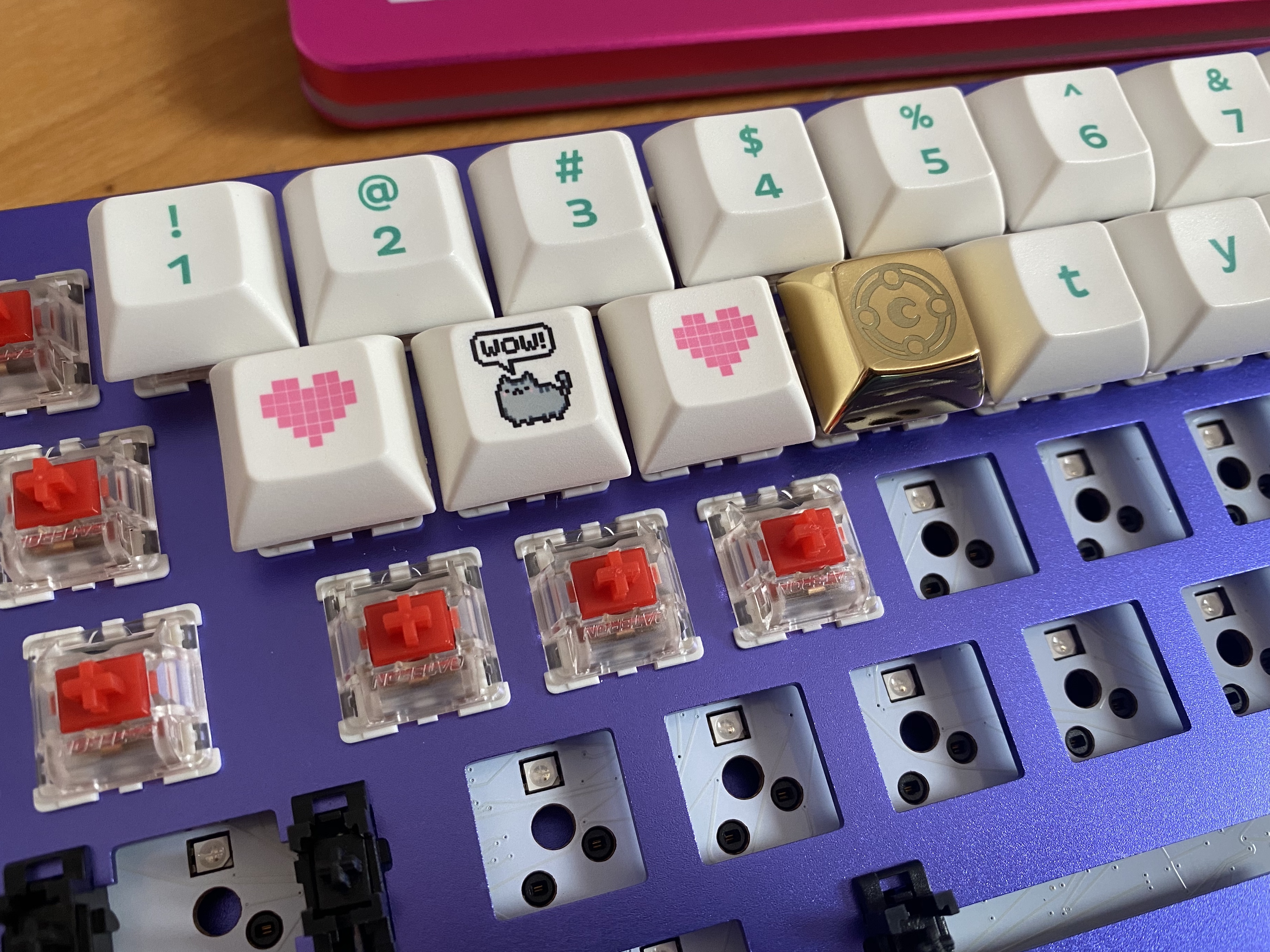 Image of a mechanical keyboard case with switches and keycaps partially installed.